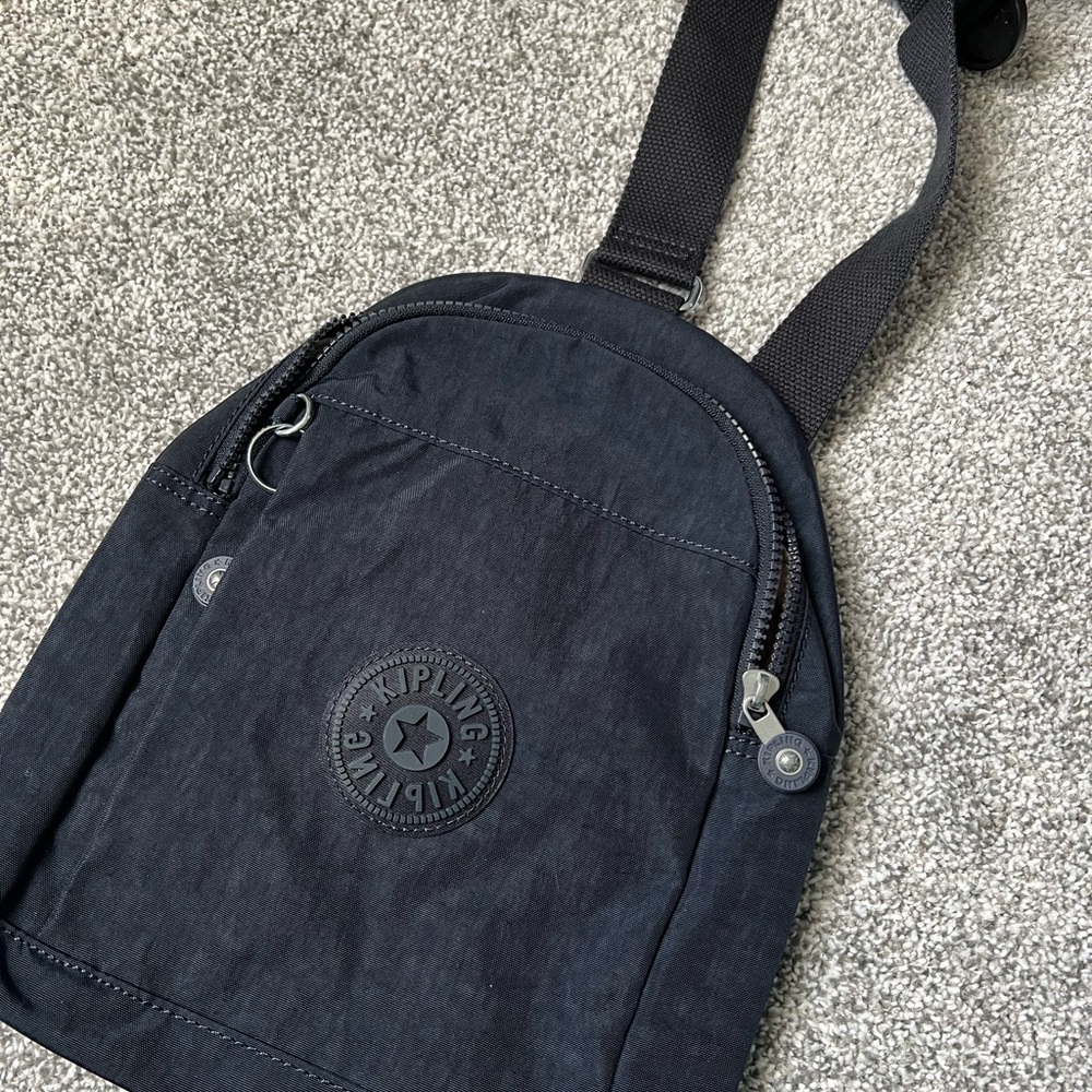 NWOT Kipling Black Nylon Sling Bag with Logo Patch